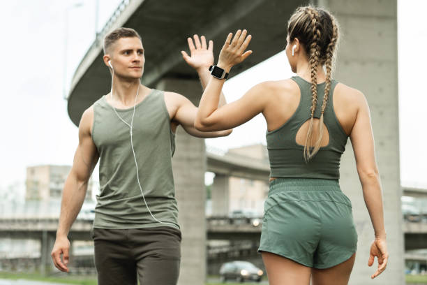 Partner helping with gym exercise